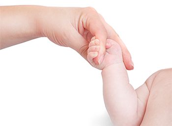 Child holding Mothers Finger - adoption through an attorney in Utah