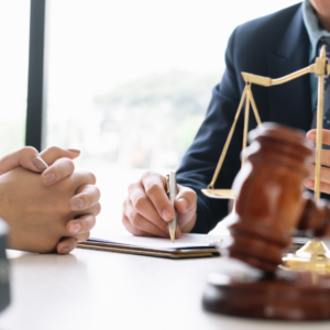 Bilingual Spanish-speaking family lawyer assisting a client with legal paperwork