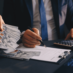 Calculating Utah child support payments with cash and calculator on table