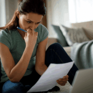 Individual reviewing divorce documents and feeling uncertain